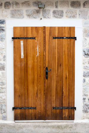 Old wooden medieval doors in the old town of Kotor Montenegro.の写真素材