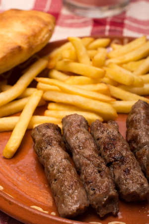 French fries with kebabs and bread bun  served.の写真素材