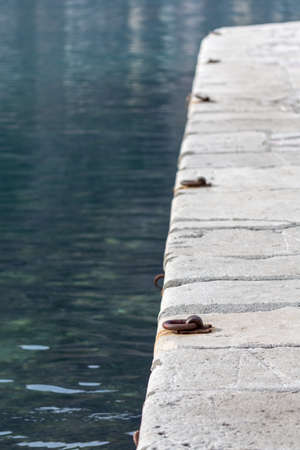 Concrete dock for sea boats.