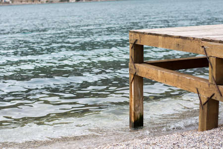 Wooden dock with sea in the background.の写真素材