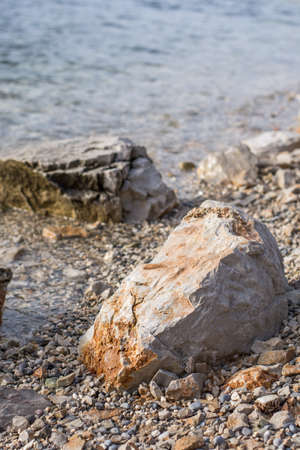 Big rocks on the beach with sea waves.の写真素材