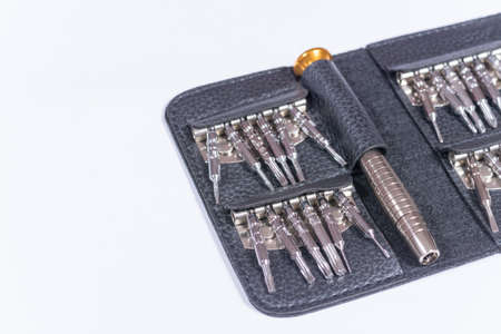 Screwdriver set in the black leather package.の写真素材