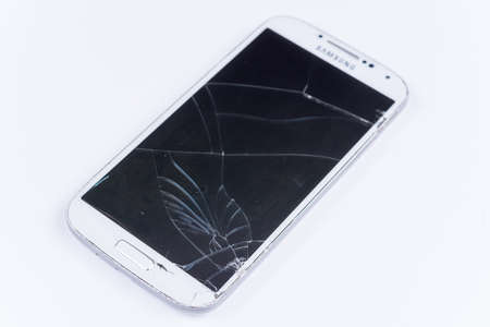 Crashed lcd on the white mobile phone.の写真素材