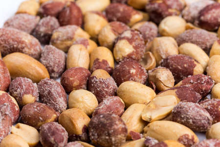 Top macro view of roasted pile of peanuts.の写真素材
