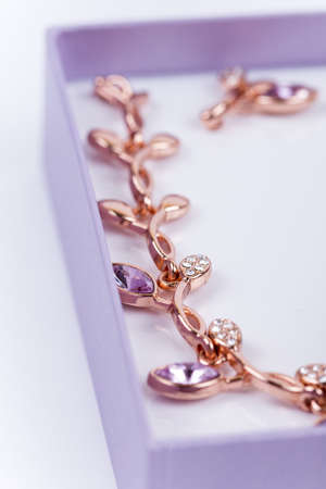 Beautiful necklace with earrings in a purple gift box.の写真素材