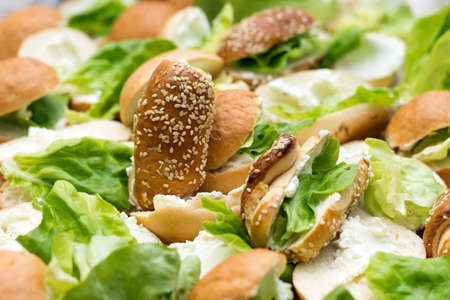 Pile of fresh sandwiches with lettuce.