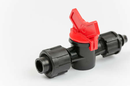 Macro shot of irrigation valves over white background.