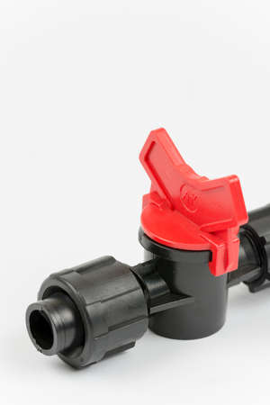 Macro shot of irrigation valves over white background.