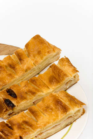 Sliced pastry with cheese and meat.の写真素材