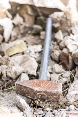 Big metal hammer on the ruins.の写真素材