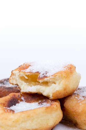 Homemade donuts with sugar over white background.の写真素材