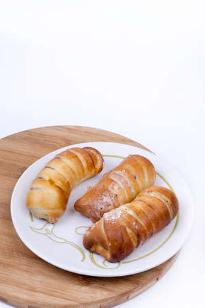 Homemade sweet baked rolls buns copy space over white.