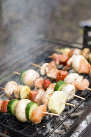 Selective focus on the meat and vegetables on the grill.
