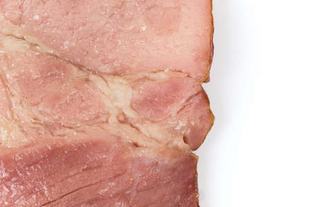 Cooked smoked ham isolated over white background.の写真素材