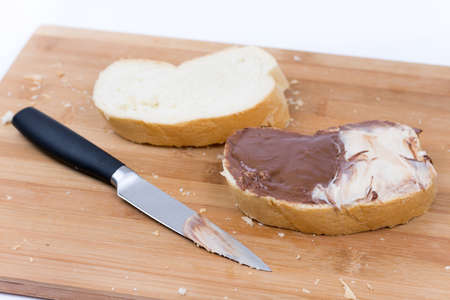Bread with chocolate and hazelnuts cream on the bread.