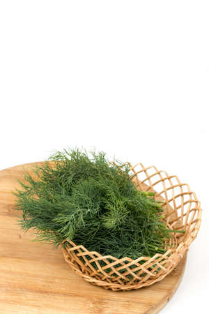 Fresh dill in the wooden basketの写真素材