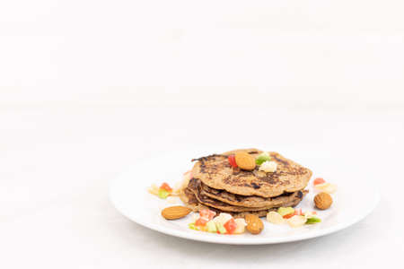 American pancakes with banana and dried fruits.の写真素材