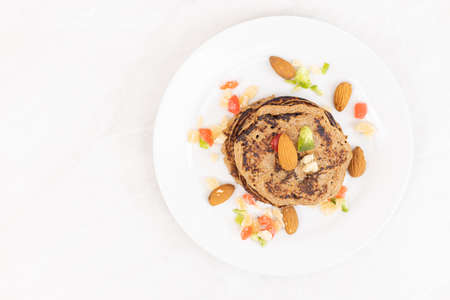 Flat lay American pancakes with banana and dried fruits and copy space.の写真素材