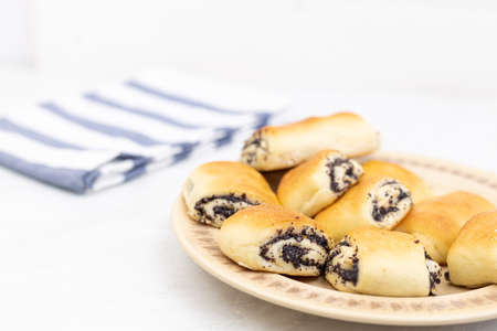 Poppy seeds cookies served on the plate.の写真素材