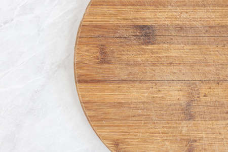 Flatlay above kitchen wooden board with kitchen dishtowel with copy space.