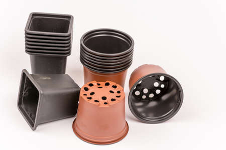 Black and orange square and round flower potsの写真素材