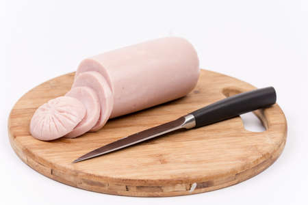 Bologna salami sliced on the wooden board, isolated on white background