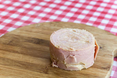 Luncheon meat on the wooden boardの写真素材