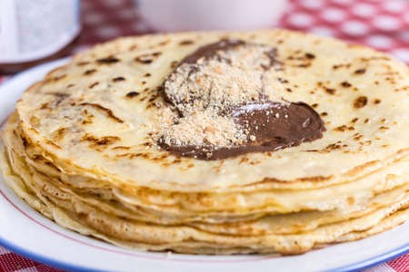 Pancakes with cream and grated biscuits
