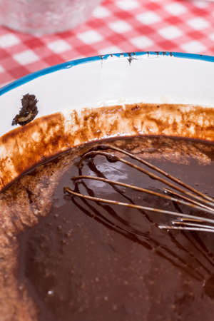 Metal mixing wire in melted chocolate creamの写真素材