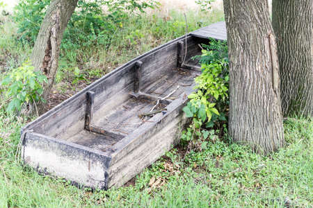Old wooden fishing boat on the ground