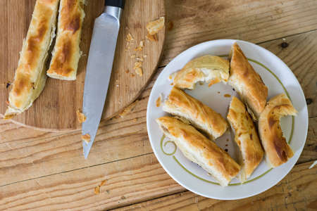 Sliced burek with meat on the plate