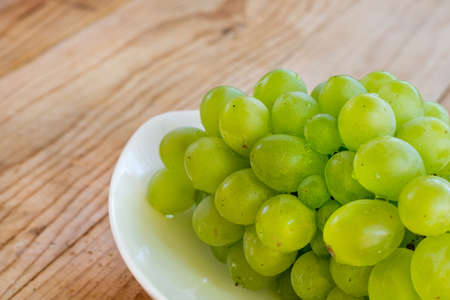 Fresh grapes on the plateの写真素材