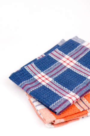 Blue and orange new kitchen dishtowels over white background