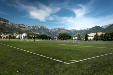 Soccer football field from corner view with blue skyの写真素材