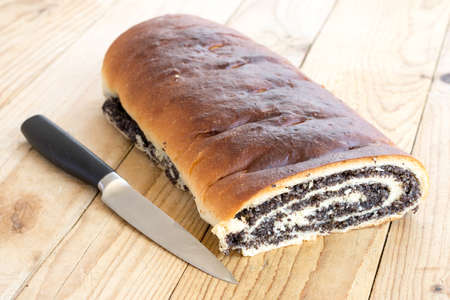 Strudel with poppy seeds on the wooden retro tableの写真素材