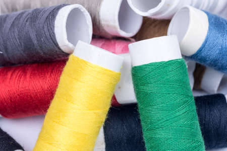Pile of colorful threads over white backgroundの写真素材