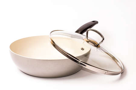 Empty ceramic frying pan with a lid on a white backgroundの写真素材