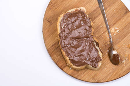 Chocolate nougat cream on the breadの写真素材