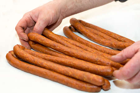 Smoked pork sausages on the table.