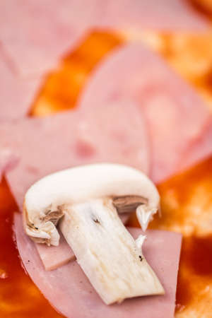 Pizza with ham ketchup and mushroomの写真素材
