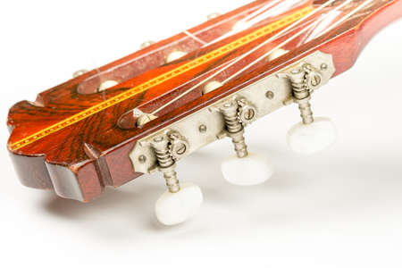 Head of the acoustic guitar over white background with copy space