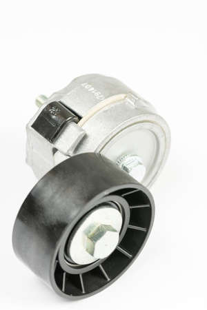 Car belt tensioner roller isolated over whiteの写真素材