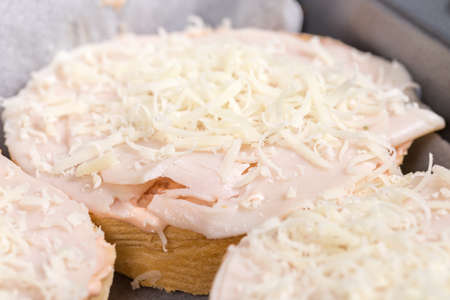 Closeup macro sandwich with ham and grated cheese