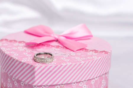 Pink heart shaped gift box wedding ringの写真素材