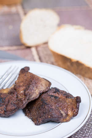 Fried pork liver served on the plate.の写真素材