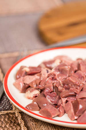 Closeup macro sliced chicken liver on the plateの写真素材