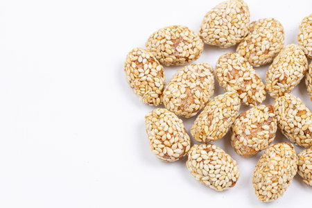 Fried peanuts with sesame above white background
