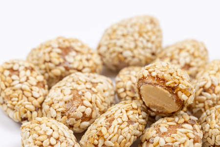 Fried peanuts with sesame above white backgroundの写真素材