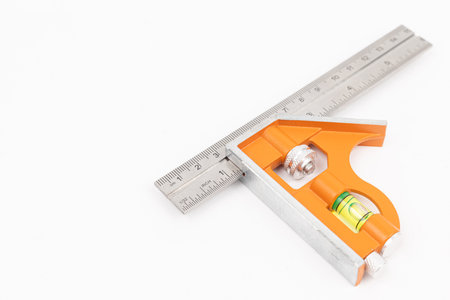 Combination square tool isolated above white background.の写真素材