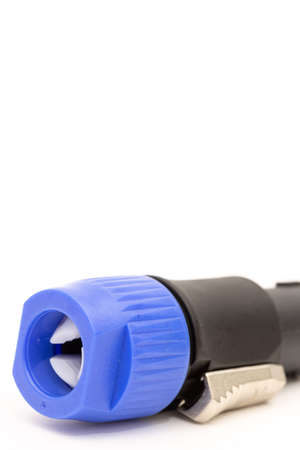 Plastic input Speakon for large speakers isolated above white background.